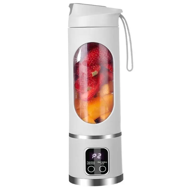 Tumbla Go portable blender in white, filled with strawberries and mango